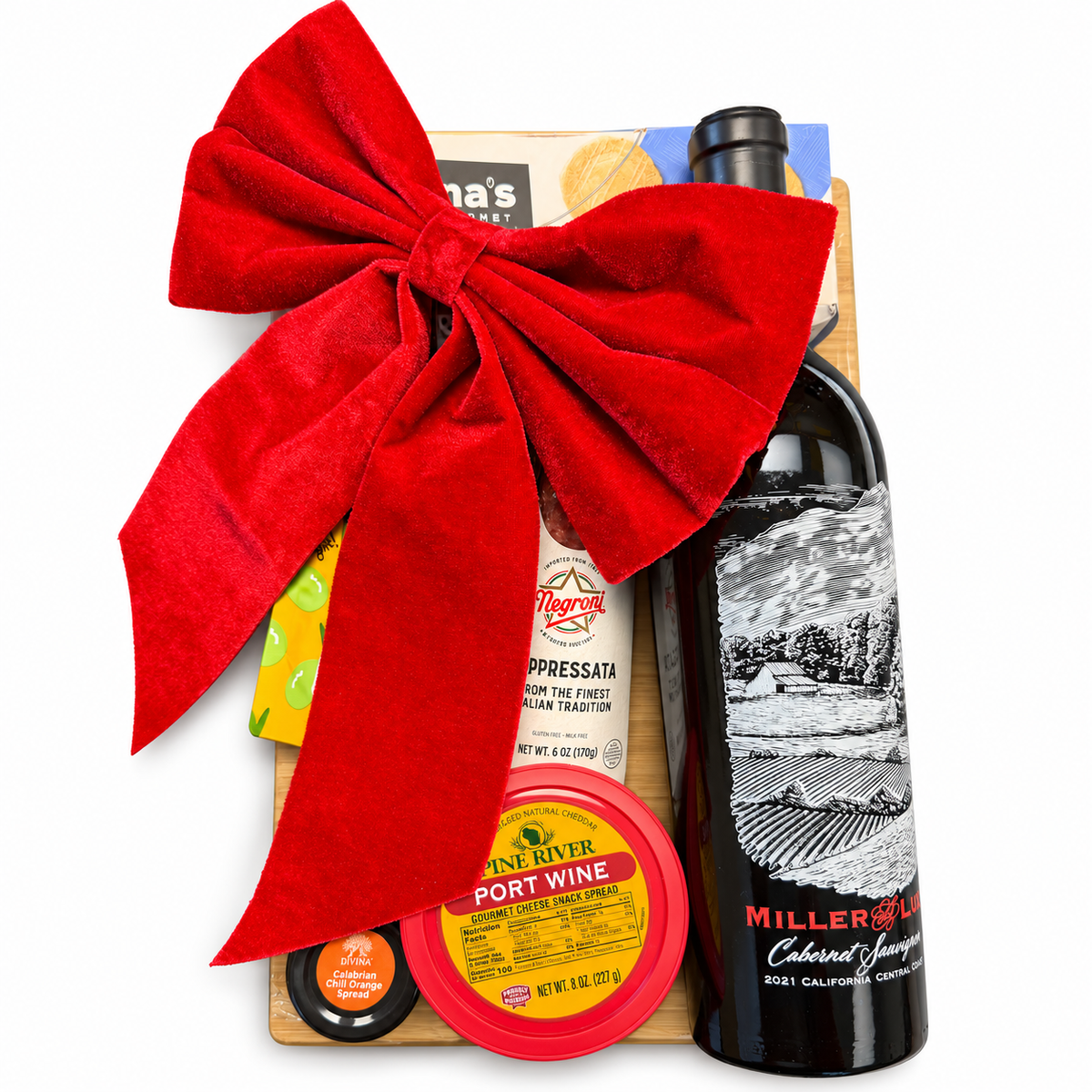 Cutting Board gift presentation with a red bow, one Miller and Lux Cabernet Sauvignon bottle and gourmet foods on a clean white background.