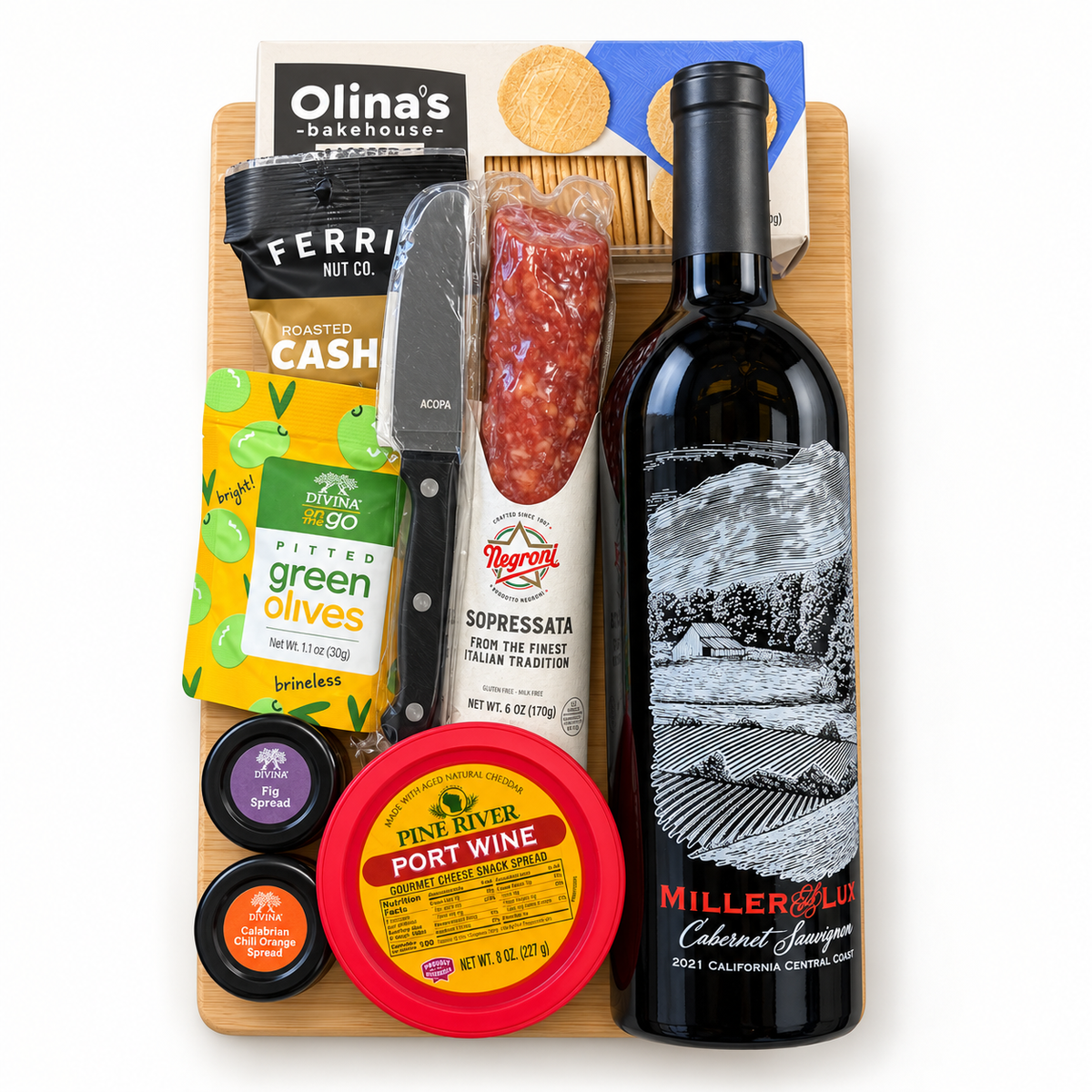 Cutting Board gift set with one Miller and Lux Cabernet Sauvignon bottle, gourmet foods, Fig and Calabrian Chili Orange spreads, and Acopa cheese knife.